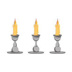 Set of wax candles in metal candlesticks