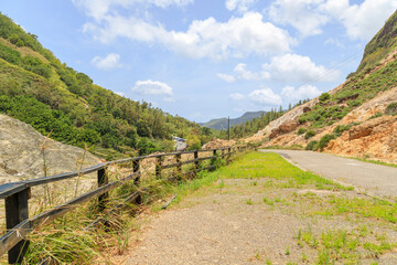 Fototapeta na wymiar road in hilly terrain in Sulphur Springs, Soufriere, Saint Lucia