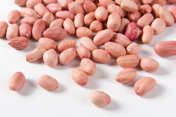  raw peanuts seed in a plate on white background