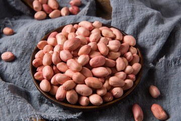 raw peanuts seed on wooden background