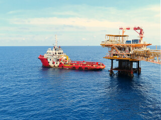 Supply boat transfer the cargo for supporting oil and gas industry and moving cargo from the boat...