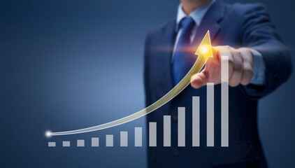 Businessman point hand on arrow graph with high rate of growth show Financial, sale profit,...