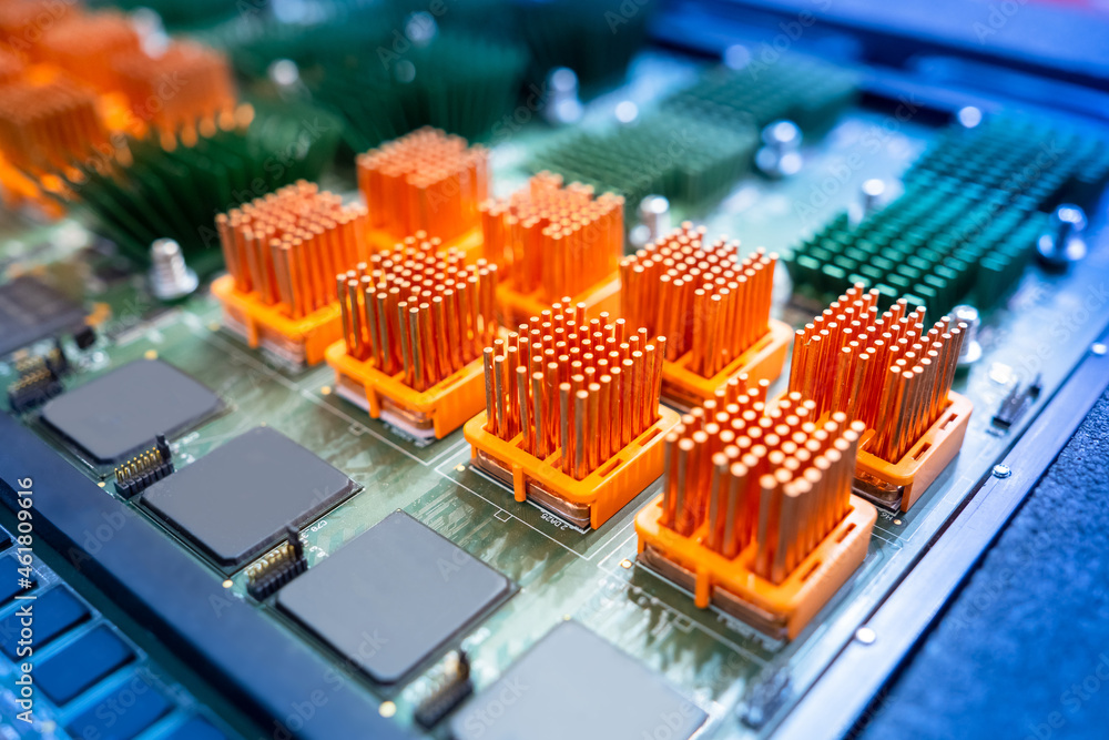 Poster computer board with orange heatsinks. pcb heat sinks are equipped with heat sinks. individual heatsi