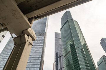 Moskva-city. Russian capital. Moscow building close up. Bottom view of the skyscrapers in center of Business center of Moscow. Office real estate. High-rise buildings against the blue sky.