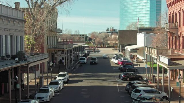 Aerial: Old Sacramento historic district with gold rush rer buildings. California, USA