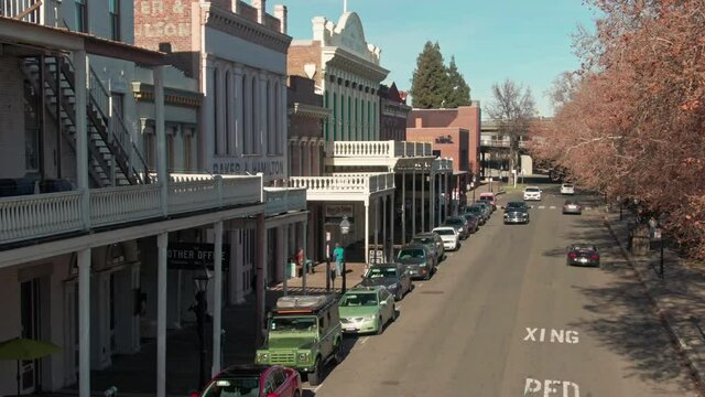 Aerial: Old Sacramento historic district with gold rush rer buildings. California, USA