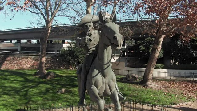 Aerial: Pony Express Statue in Old Sacramento historic district. California, USA