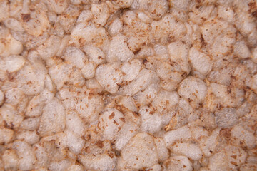Background of crunchy rice crispbread with bran
