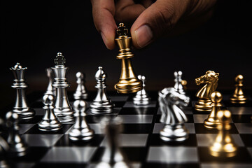 Close up king chess challenge or battle fighting with falling chess on chess board concepts of leadership and strategy or strategic plan and human resource or risk management or team player.