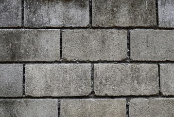 Scratches with brown and black dirt on the rough gray surface of the concrete wall, Background and Texture for add text or graphic design