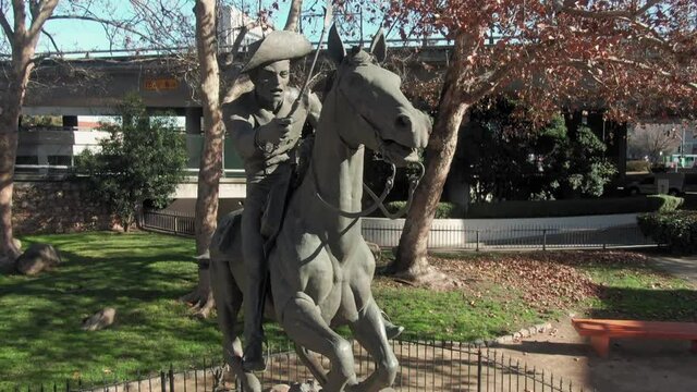 Aerial: Pony Express Statue in Old Sacramento historic district. California, USA