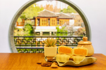 Moon cake with pretty background, a traditional food, cuisine, or snack for Chinese or Asian  Mid-Autumn festival 