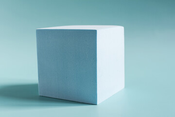 Abstract blue cube close-up on a blue background is a place for text