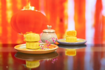 Moon cake with pretty background, a traditional food, cuisine, or snack for Chinese or Asian  Mid-Autumn festival 