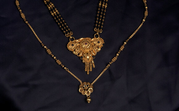 Mangalsutra or Golden Necklace to wear by a married hindu women, arranged with beautiful backgrond. Indian Traditional Jewellery.