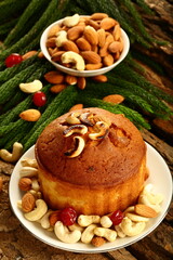 Homemade rich plum cake with cashew nuts and dry fruits.
