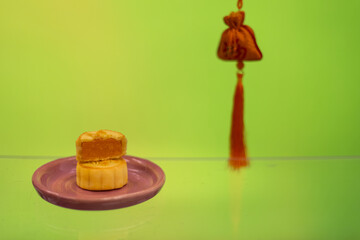 Moon cake with pretty background, a traditional food, cuisine, or snack for Chinese or Asian  Mid-Autumn festival 