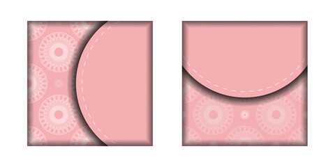 The brochure in pink with a mandala in a white pattern is ready for printing.