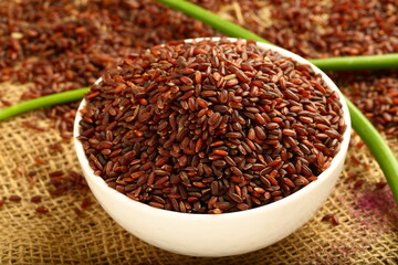 Fresh harvested organic red rice ,brown rice grains.