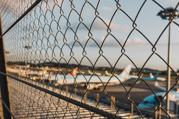 airport behind the iron fence