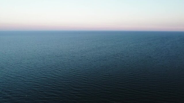 Sea surface in calm, windless weather.