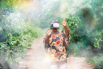 Seniors in virtual reality glasses playing the game. Older woman with vr headset in garden, concept...
