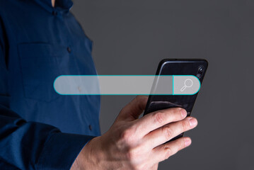 Man hand holding smartphone with virtual screening searching.