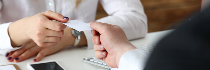 Female hand in suit give blank calling card