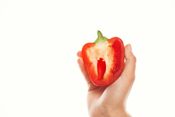 red pepper in hand cooking ingredient vegetables light background