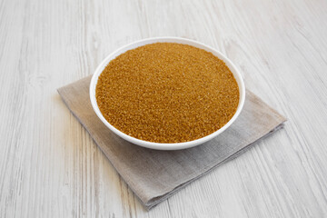 Organic Brown Sugar in a White Bowl, side view.