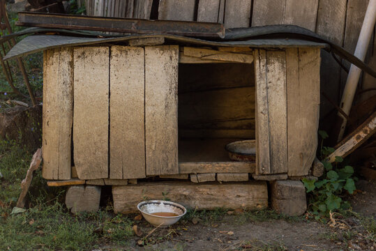 Old Wooden Dog Cage. Dog House In The Yard 