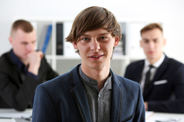 Handsome smiling businessman in suit portrait