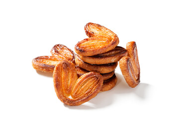 Puff pastry cookies palmier or elephant ears, caramelized and crunchy pastry. Isolated on white background