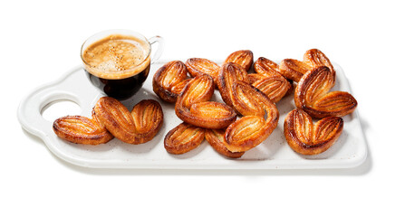 Puff pastry cookies palmier or elephant ears, caramelized and crunchy pastry. Isolated on white background
