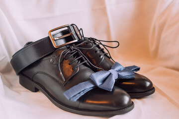 the groom's black shoes at the training camp