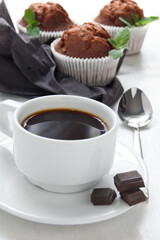 Morning coffee with chocolate muffins on the white background