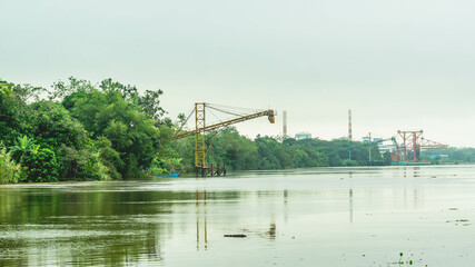 Huge conveyor at Mahakam Riverbank used to load coal to the barge. Industrial and mining background