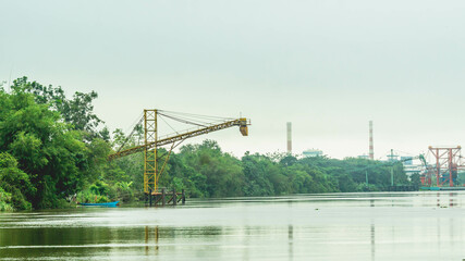 Huge conveyor at Mahakam Riverbank used to load coal to the barge. Industrial and mining background