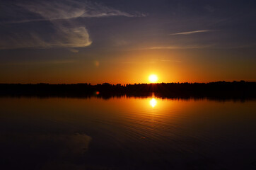 Fototapeta na wymiar Sunset on the river in summer
