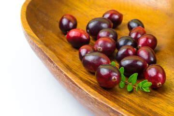 Cranberries isolated on white with green leaf, half with seeds and whole fresh red fall berry