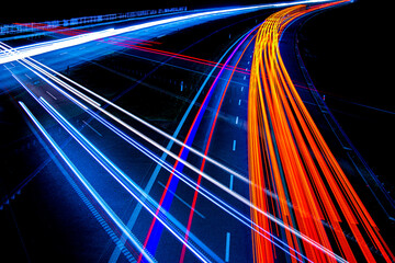 Night road lights. Lights of moving cars at night. long exposure red, blue, green, orange.