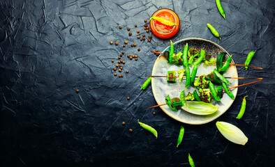Roasted vegetables on skewers,space for text