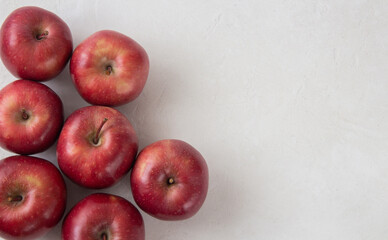 Fresh red apples on a gray background with copy space. view from above. agriculture. Fortified product. Vegetarian food. 