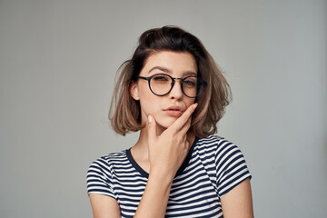 woman in a striped T-shirt modern style hairstyle