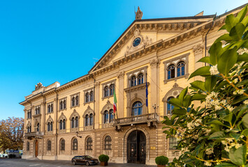 Fototapeta na wymiar Cuneo, Piedmont, Italy - October 6, 2021: The building Prefecture Cuneo (designed by Pietro Carrera 1882) in street Rome, majestic neoclassical building at the beginning of via Roma