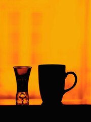 cup of tea and shot glass