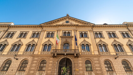 Cuneo, Piedmont, Italy - October 6, 2021: The building Prefecture Cuneo (designed by Pietro Carrera 1882) in street Rome, majestic neoclassical building at the beginning of via Roma