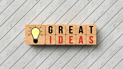 wooden cubes with message GREAT IDEAS on wooden background