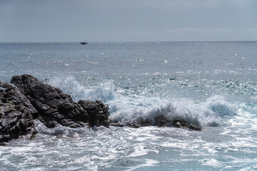 waves crashing on rocks
