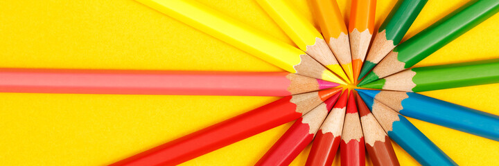 Education, students use colored pencils to draw pictures at the library.